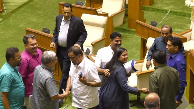 Goa chief minister Manohar Parrikar and MGP legislator Sudhin Dhavlikar greet each other after passing the floor test held at the Goa Assembly Complex on Thursday. (HT Photo) Goa chief minister Manohar Parrikar and MGP legislator Sudhin Dhavlikar greet each other after passing the floor test held at the Goa Assembly Complex on Thursday. (HT Photo)