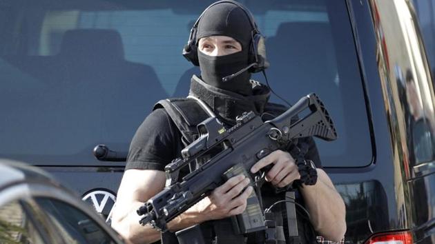 A member of special police unit RAID outside the Tocqueville high school after a shooting incident injured people in Grasse, southern France.(Reuters)