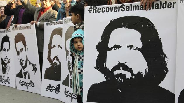 In this file photo taken on Thursday, January 12, 2017, activists from Pakistan's civil society demand recovery of the missing persons, in Lahore, Pakistan. Pakistan's controversial blasphemy law which demands death to anyone accused of insulting Islam or its prophet has been a rallying cry for extremist groups who threaten violence at any attempt to prevent abuses, never mind repeal it. (AP Photo) In this file photo taken on Thursday, January 12, 2017, activists from Pakistan's civil society demand recovery of the missing persons, in Lahore, Pakistan. Pakistan's controversial blasphemy law which demands death to anyone accused of insulting Islam or its prophet has been a rallying cry for extremist groups who threaten violence at any attempt to prevent abuses, never mind repeal it. (AP Photo)