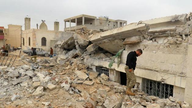 People inspect a damaged mosque after an airstrike on the rebel-held village of al-Jina, Aleppo province in northwest Syria on March 17.(REUTERS)