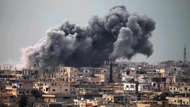 Smoke billows following reported air strikes on a rebel-held area in the southern city of Daraa. (AFP Photo) Smoke billows following reported air strikes on a rebel-held area in the southern city of Daraa. (AFP Photo)