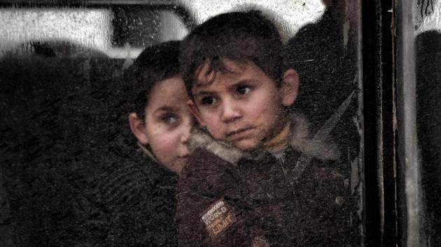 Displaced children evacuate a neighbourhood in West Mosul. Nearly six million children now depend on humanitarian assistance in the conflict, more than 12 times the number five years ago. (ARIS MESSINIS / AFP)