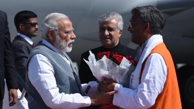 Prime Minister Narendra Modi is received by CM designate Trivendra Singh Rawat at Dehradun airport as he arrives for the swearing-in ceremony. (Twitter/@PMOIndia) Prime Minister Narendra Modi is received by CM designate Trivendra Singh Rawat at Dehradun airport as he arrives for the swearing-in ceremony. (Twitter/@PMOIndia)