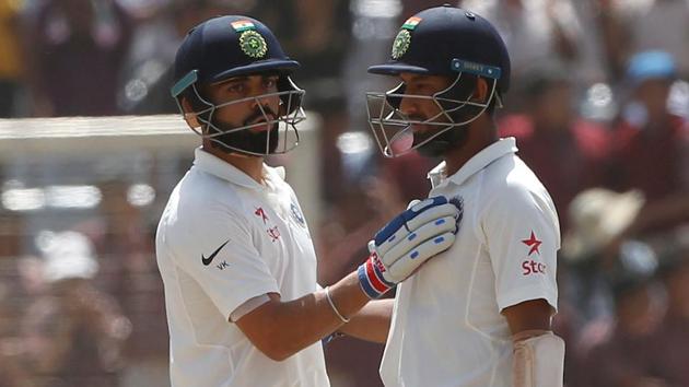 Cheteshwar Pujara (L) and Virat Kohli on Day 3 of the third Test between India and Australia in Ranchi. 