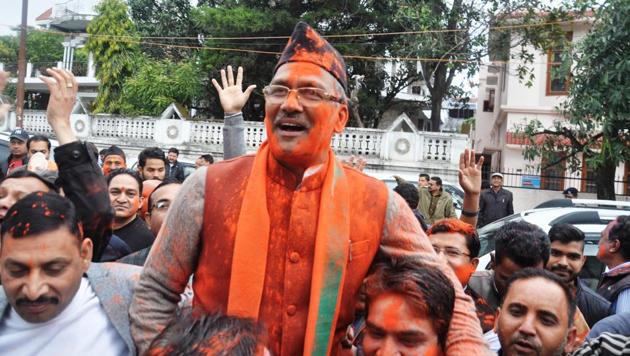 BJP workers hold BJP leader Trivendra Singh Rawat outside the BJP office in Dehradun following the party’s poll victory on Saturday. He will be sworn in as the state’s chief minister. (Vinay Santosh Kumar/Hindustan Times) BJP workers hold BJP leader Trivendra Singh Rawat outside the BJP office in Dehradun following the party’s poll victory on Saturday. He will be sworn in as the state’s chief minister. (Vinay Santosh Kumar/Hindustan Times)