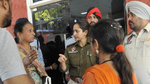 Family members of Pankaj Sharma who was attacked at district courts, Ludhiana on Saturday. (HT Photo) Family members of Pankaj Sharma who was attacked at district courts, Ludhiana on Saturday. (HT Photo)