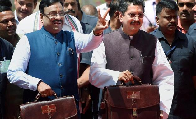 Maharashtra finance minister Sudhir Mungantiwar (left) and MoS finance Deepak Kesarkar with the state budget before entering Vidhan Bhawan in Mumbai on Saturday. (PTI) Maharashtra finance minister Sudhir Mungantiwar (left) and MoS finance Deepak Kesarkar with the state budget before entering Vidhan Bhawan in Mumbai on Saturday. (PTI)