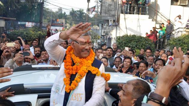 BJP leader Trivendra Singh Rawat being greeted by supporters after he was elected as the party's legislative party leader in Dehradun on Friday. He will be sworn in on Saturday.(PTI)