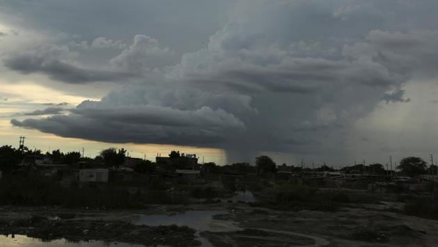 View of the town of El Polvorin with clouds in the sky, in Piura. (Mariana Bazo / REUTERS) 