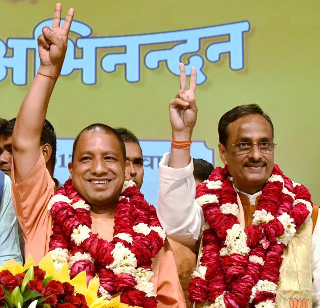 Yogi Adityanath (L) after being elected as the BJP legislature party leader in Lucknow on Saturday. (PTI) Yogi Adityanath (L) after being elected as the BJP legislature party leader in Lucknow on Saturday. (PTI)