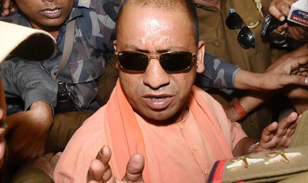 Yogi Adityanath enters the venue of the BJP's legislature party meeting in Lucknow on Saturday.(PTI photo) Yogi Adityanath enters the venue of the BJP's legislature party meeting in Lucknow on Saturday.(PTI photo)