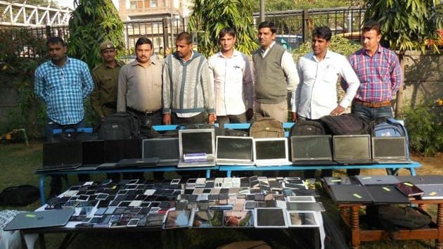 Cops display laptops and mobile phones seized from the shopkeepers. (HT Photo) Cops display laptops and mobile phones seized from the shopkeepers. (HT Photo)