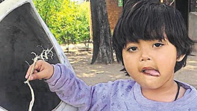 Priya deposits litter at a Sukhna lake dustbin.(Vikram Jit Singh)