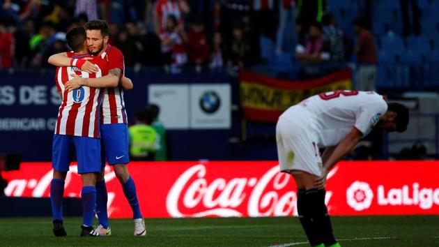 Atletico Madrid's Koke and Saul celebrate their victory over Sevilla FC in La Liga on Sunday. (REUTERS) Atletico Madrid's Koke and Saul celebrate their victory over Sevilla FC in La Liga on Sunday. (REUTERS)