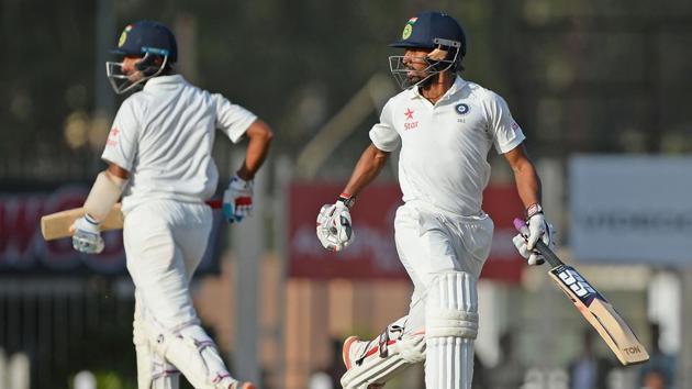 Cheteshwar Pujara (left) and Wriddhiman Saha were involved in a 199-run stand for India against Australia on Day 4 of the third Test in Ranchi. Get cricket score of India vs Australia here.(AFP)