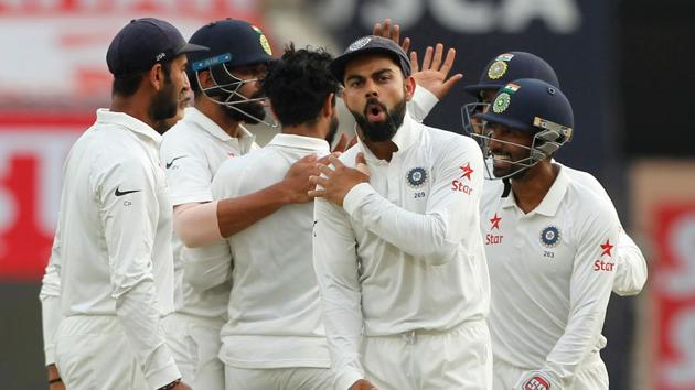 Virat Kohli celebrates the dismissal of David Warner with teammates during Day 4 of the third Test between India and Australia in Ranchi on Sunday.(BCCI)