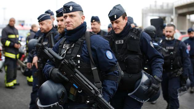 French policemen secure the area at the Paris' Orly airport on March 18, 2017 following the shooting of a man by French security forces.(AFP Photo) French policemen secure the area at the Paris' Orly airport on March 18, 2017 following the shooting of a man by French security forces.(AFP Photo)
