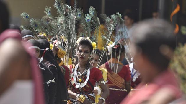 A folk artist from Madhya Pradesh waiting for her turn to perform during the Rashtriya Ekta Shivir at Rajghat in New Delhi. (Raj K Raj/HT PHOTO)