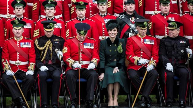 Britain's Prince William and Catherine, the Duchess of Cambridge, sit for an official photograph with warrant officers of the 1st Battalion Irish Guards following their St Patrick's Day parade at Cavalry Barracks, Hounslow. (Richard Pohle / REUTERS) Britain's Prince William and Catherine, the Duchess of Cambridge, sit for an official photograph with warrant officers of the 1st Battalion Irish Guards following their St Patrick's Day parade at Cavalry Barracks, Hounslow. (Richard Pohle / REUTERS)