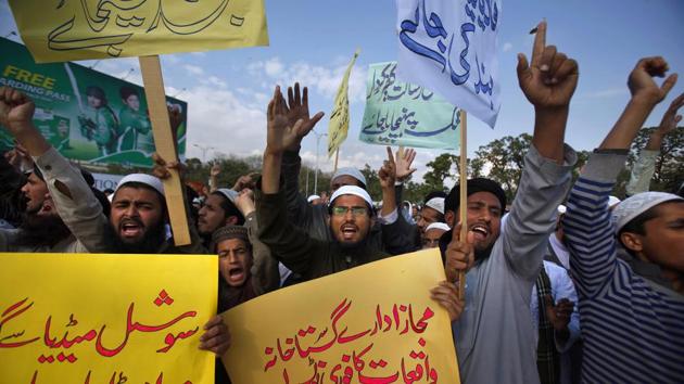 Pakistani students of Islamic seminaries chant slogans during a rally in support of blasphemy laws in Islamabad, Pakistan. (AP Photo) Pakistani students of Islamic seminaries chant slogans during a rally in support of blasphemy laws in Islamabad, Pakistan. (AP Photo)