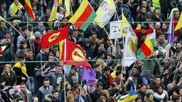 People hold placards during a demonstration organised by Kurds, in Frankfurt, Germany on Saturday. (REUTERS) People hold placards during a demonstration organised by Kurds, in Frankfurt, Germany on Saturday. (REUTERS)