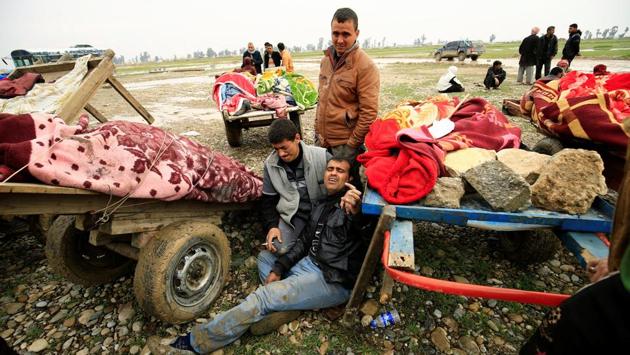 Relatives react near the bodies of civilians killed in air strike, during a battle between Iraqi forces and Islamic State militants, in Mosul, Iraq. (Thaier Al-Sudani / REUTERS) Relatives react near the bodies of civilians killed in air strike, during a battle between Iraqi forces and Islamic State militants, in Mosul, Iraq. (Thaier Al-Sudani / REUTERS)