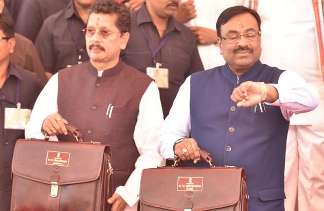 State Finance Minister Sudhir Mungantiwar (right) and MoS Deepak Kesarkar before presenting the state budget on Saturday. (Anshuman Poyrekar/HT Photo) State Finance Minister Sudhir Mungantiwar (right) and MoS Deepak Kesarkar before presenting the state budget on Saturday. (Anshuman Poyrekar/HT Photo)