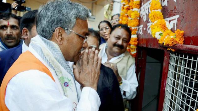 Uttarakhand chief minister Trivendra Singh Rawat paying homage to martyrs before the swearing-in ceremony in Dehradun on Saturday. (PTI) Uttarakhand chief minister Trivendra Singh Rawat paying homage to martyrs before the swearing-in ceremony in Dehradun on Saturday. (PTI)