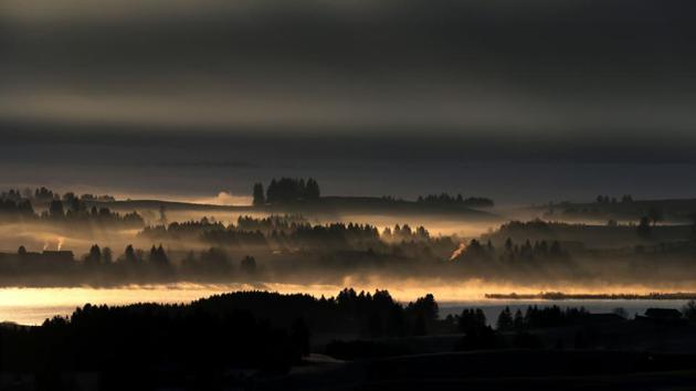 The sunrise in early-morning haze is pictured in the region of Koenigswinkel, southern Germany. (Karl-Josef Hildenbrand / AFP) The sunrise in early-morning haze is pictured in the region of Koenigswinkel, southern Germany. (Karl-Josef Hildenbrand / AFP)