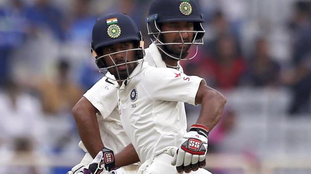 Wriddhiman Saha and Cheteshwar Pujara of India cricket team during Day 4 of the third Test vs Australia cricket team in Ranchi on Sunday.(AP)