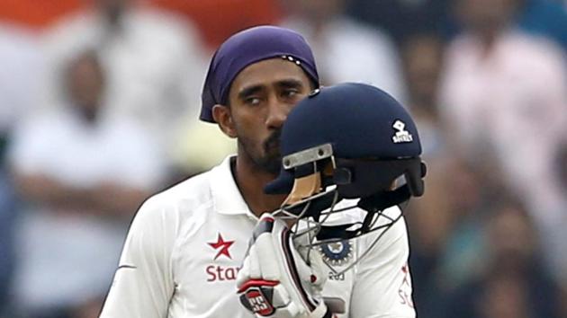 Wriddhiman Saha slammed his third Test ton and shared a record 199-run stand for the seventh wicket with Cheteshwar Pujara, who scored his third double ton.(AP)