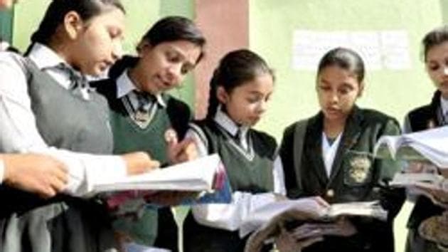 Students of Class 12 take a last look at their notes ahead of exams.(PTI FILE)