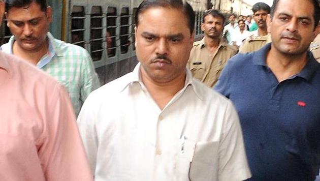 Former Delhi law minister Jitendra Singh Tomar in police custody for obtaining a fake law degree.(HT file photo)