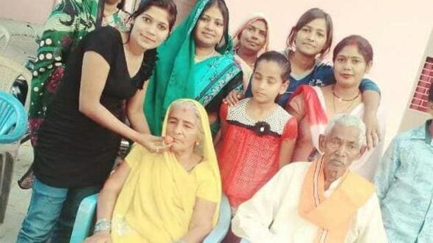 Keshav Prasad Maurya’s parents (sitting) celebrating as Maurya was sworn in as deputy CM.(HT Photo)