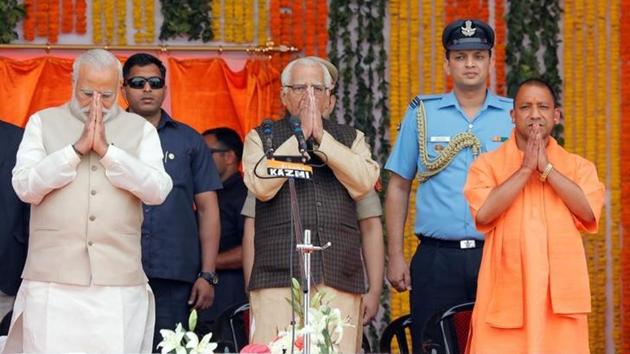 PM Narendra Modi, UP governor Ram Naik and chief minister Yogi Adityanath after his swearing-in ceremony in Lucknow.(Reuters Photo)