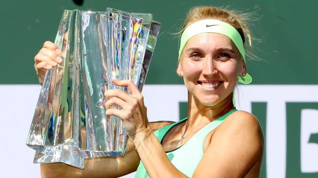 Elena Vesnina celebrates with the Indian Wells trophy after defeating Svetlana Kuznetsova.(AFP)