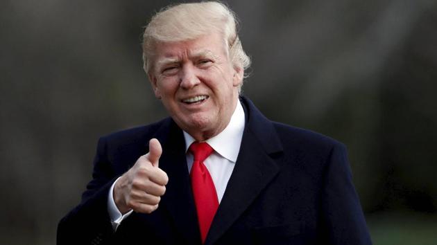 President Donald Trump gives a thumbs up as he walks to the White House after arriving on Marine One, Sunday, March 19, 2017, in Washington.(AP)