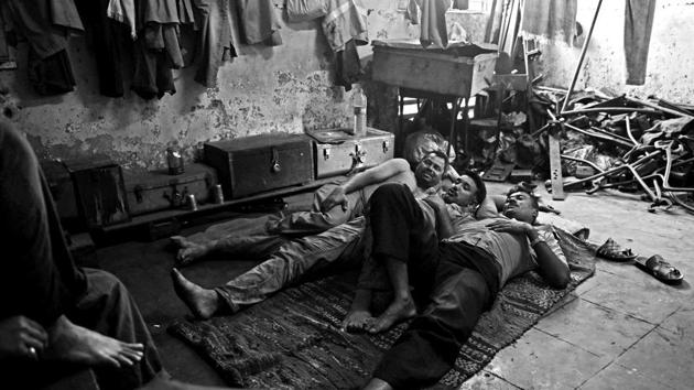 The tapri is a bare bare room with hooks in place of furniture. There is no running water and no toilet. There’s a mat the men share in place of a bed; tools and parts are piled to one side.  (Pratik Chorge/HT PHOTO) 