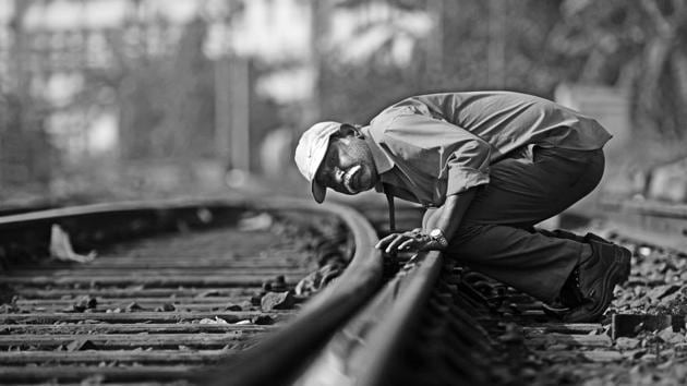 It’s a dangerous life too. As trains hurtle towards them, gangmen have just seconds to get out of the way. Here, Ramesh Bhadange checks the levels of a track, on a railway line that sees a train whiz past every three minutes. Bhadange is 57 and retires in three years. ‘I’m really looking forward to it,’ he says. (Pratik Chorge/HT PHOTO) 