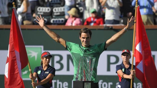 Roger Federerposes with the trophy after his win against Stan Wawrinka in the finals of the Indian Wells Masters. (AP) Roger Federerposes with the trophy after his win against Stan Wawrinka in the finals of the Indian Wells Masters. (AP)