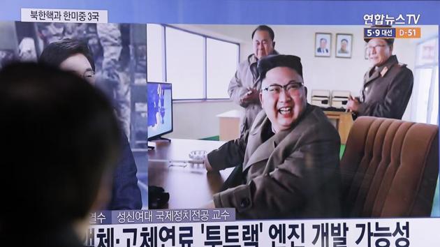 A man watches a TV news program showing an image, published in North Korea's Rodong Sinmun newspaper, of North Korean leader Kim Jong Un at the country's Sohae launch site, at Seoul Railway station in Seoul, South Korea.(AP Photo)