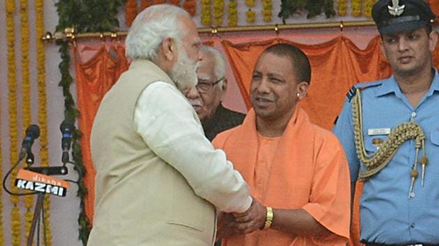 Prime Minister Narendra Modi greets Adityanath during his swearing-in ceremony as Uttar Pradesh chief minister on March 19. (Ashok Dutta/HT photo) Prime Minister Narendra Modi greets Adityanath during his swearing-in ceremony as Uttar Pradesh chief minister on March 19. (Ashok Dutta/HT photo)