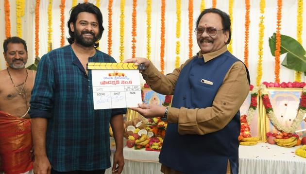 Prabhas with his uncle, yesteryear actor Krishnam Raju at the launch of his film with Sujeeth.