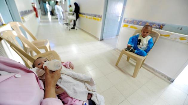 A nurse feeds a baby undergoing cancer tests, as another child with cancer sits on a chair. (Omar Sanadiki/REUTERS) A nurse feeds a baby undergoing cancer tests, as another child with cancer sits on a chair. (Omar Sanadiki/REUTERS)