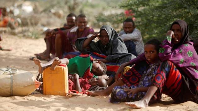 Internally displaced Somali families rest as they flee from drought stricken regions in Lower Shabelle region before entering makeshift camps in Somalia's capital Mogadishu.(Reuters File Photo)