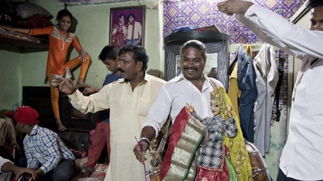 They migrated to Delhi over 100 years ago and gradually became a part of Delhi. Raj Bhatt, a local puppeteer plays drums at Kathputli Colony as his crew present a show. (Saumya Khandelwal/HT PHOTO) They migrated to Delhi over 100 years ago and gradually became a part of Delhi. Raj Bhatt, a local puppeteer plays drums at Kathputli Colony as his crew present a show. (Saumya Khandelwal/HT PHOTO)