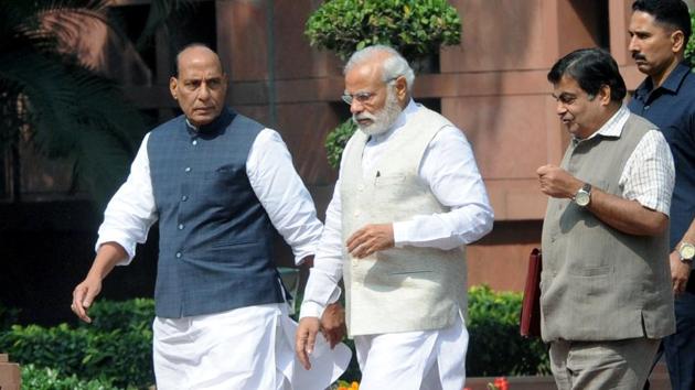 Prime Minister Narendra Modi with home minister Rajnath Singh and roads and transport minister Nitin Gadkari after a cabinet meeting at Parliament Library in New Delhi. (HT PHOTO) Prime Minister Narendra Modi with home minister Rajnath Singh and roads and transport minister Nitin Gadkari after a cabinet meeting at Parliament Library in New Delhi. (HT PHOTO)