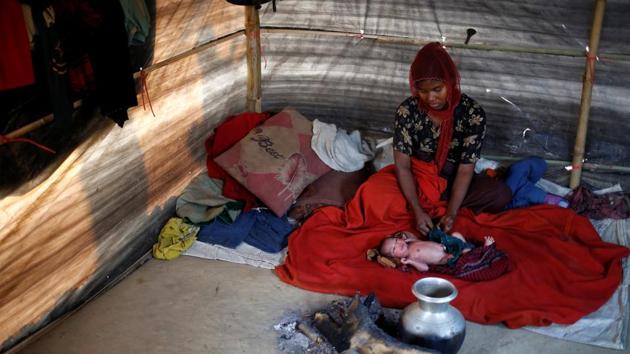 Rehana Begum, 25, sits near her one-day-old unnamed daughter inside their shelter at Kutupalang unregistered refugee camp in Cox’s Bazar. ‘We were in our home and suddenly the military came to our village and started shooting," said Rehana Begum, who fled her village of Jambuinna in Myanmar three months ago. ‘When we heard the sound of gun shots we immediately went to our relatives. We walked for four hours without any food and water to reach the border at 1 a.m. We paid $18 to a broker to cross." The figure is equivalent to 25,000 Myanmar kyat. Intercepted by Bangladesh border guards, Rehana Begum's family narrowly escaped being sent home. ‘They wanted to send us back, but then we heard gunshots from the Myanmar side and the guards released us, saying, 'Stay in Bangladesh and save your lives',’ she said. (Mohammad Ponir Hossain/REUTERS)
