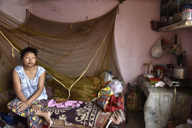 Khar’s wife, Ngaideilum, wishes she had a job to support him and her five-year-old daughter. But for refugees, finding a job is difficult -- the only documentation they have is a UNHCR card, so the only jobs they get are in the informal sector. (Saumya Khandelwal/HT PHOTO) Khar’s wife, Ngaideilum, wishes she had a job to support him and her five-year-old daughter. But for refugees, finding a job is difficult -- the only documentation they have is a UNHCR card, so the only jobs they get are in the informal sector. (Saumya Khandelwal/HT PHOTO)