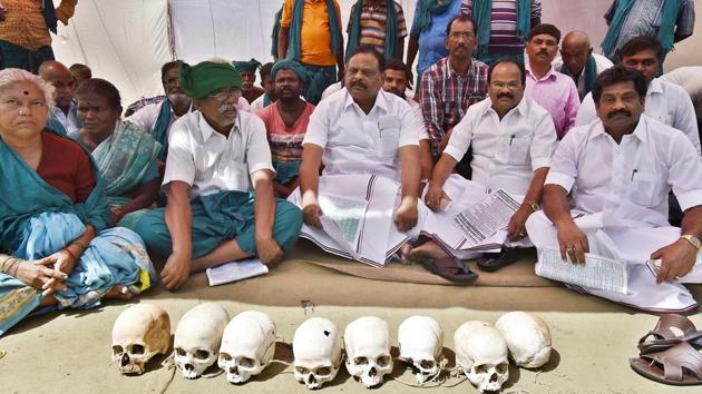 In a unique kind of protest, the farmers, all dressed in green lungis covered with leaves, are staging demonstration with dug-up skulls of fellow farmers who have committed suicide due to the drought. (Raj K Raj/HT PHOTO) In a unique kind of protest, the farmers, all dressed in green lungis covered with leaves, are staging demonstration with dug-up skulls of fellow farmers who have committed suicide due to the drought. (Raj K Raj/HT PHOTO)
